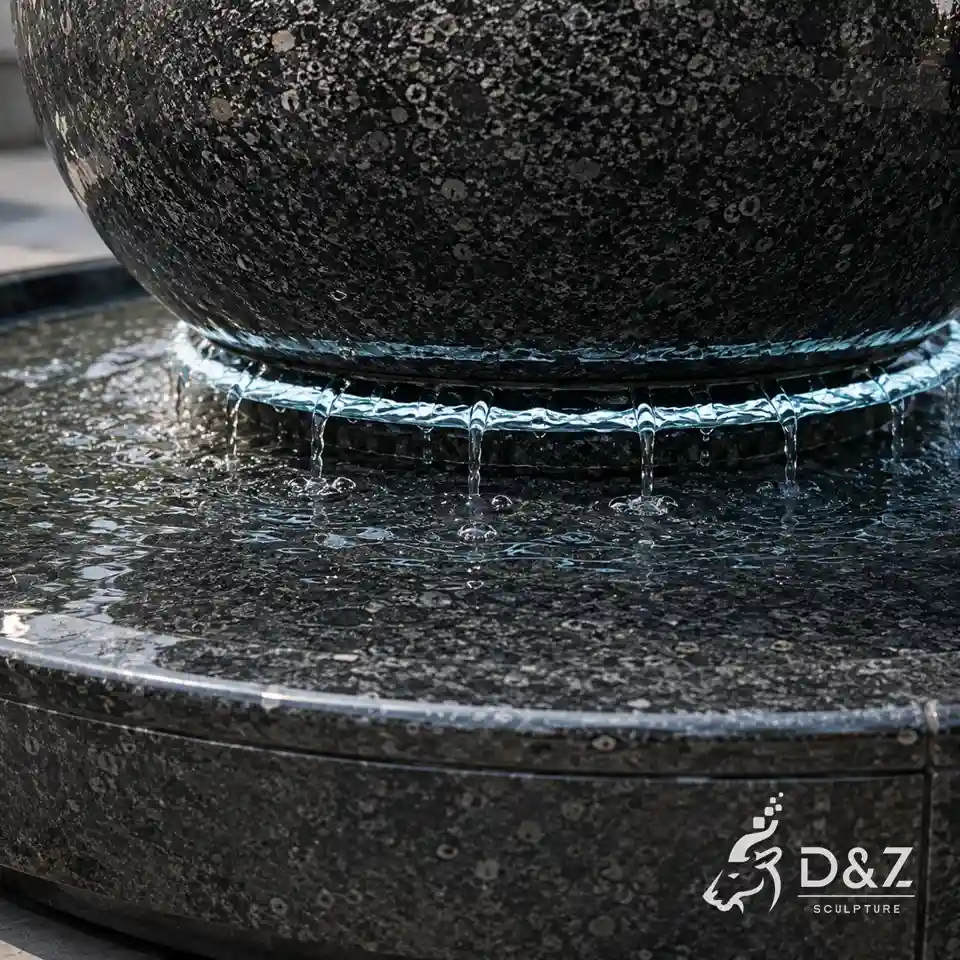 Thin water film beneath a rotating granite sphere fountain Thin water film beneath a rotating granite sphere fountain