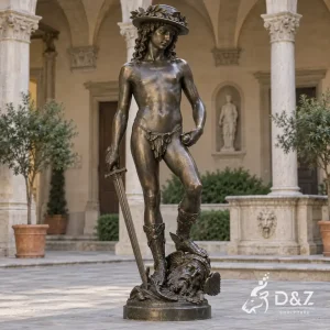 Bronze Donatello David sculpture with laurel hat, sword and Goliath head displayed in a classical courtyard